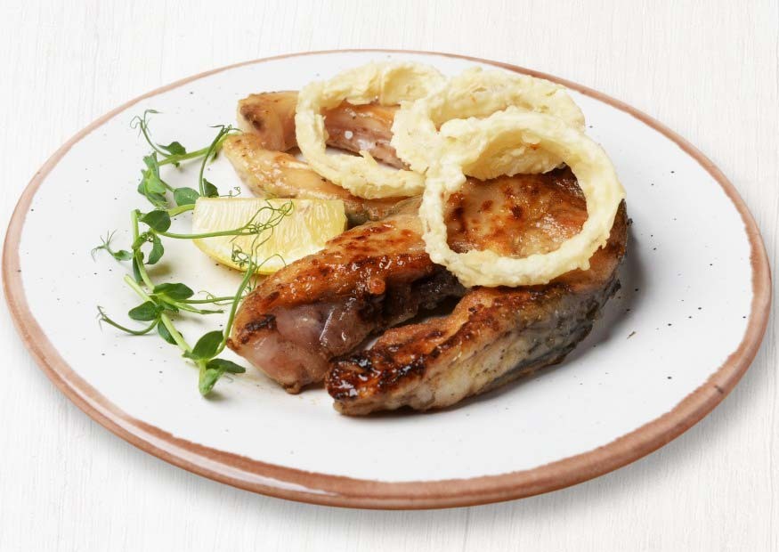 Carp steak fried to a crispy crust