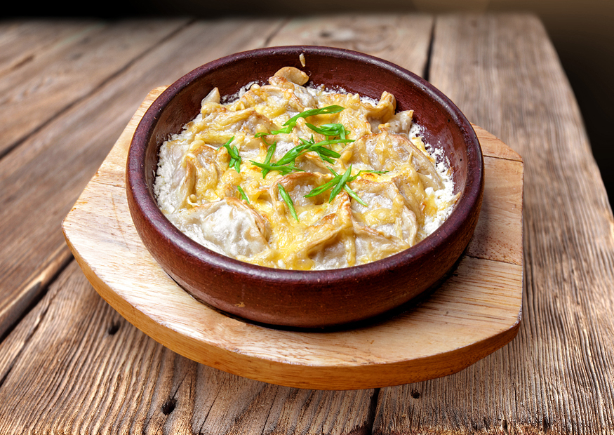 Grand ravioli baked in sour cream sauce