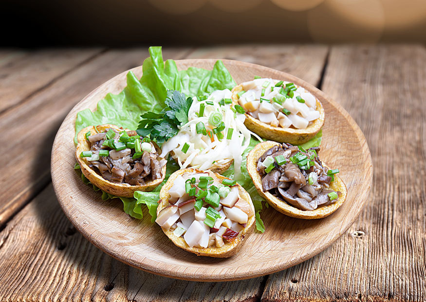 Potato halves with mushrooms and sourcrout