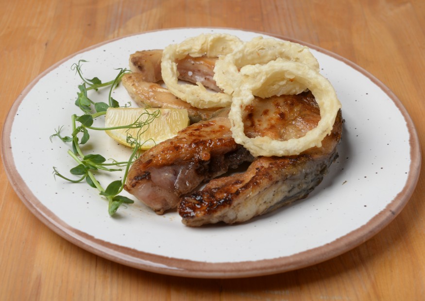 Carp steak fried to a crispy crust